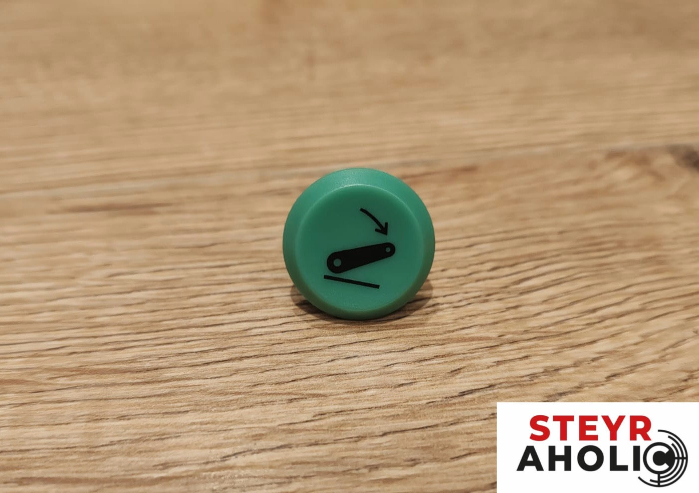 Emblem für die Druckschalter Senken grün