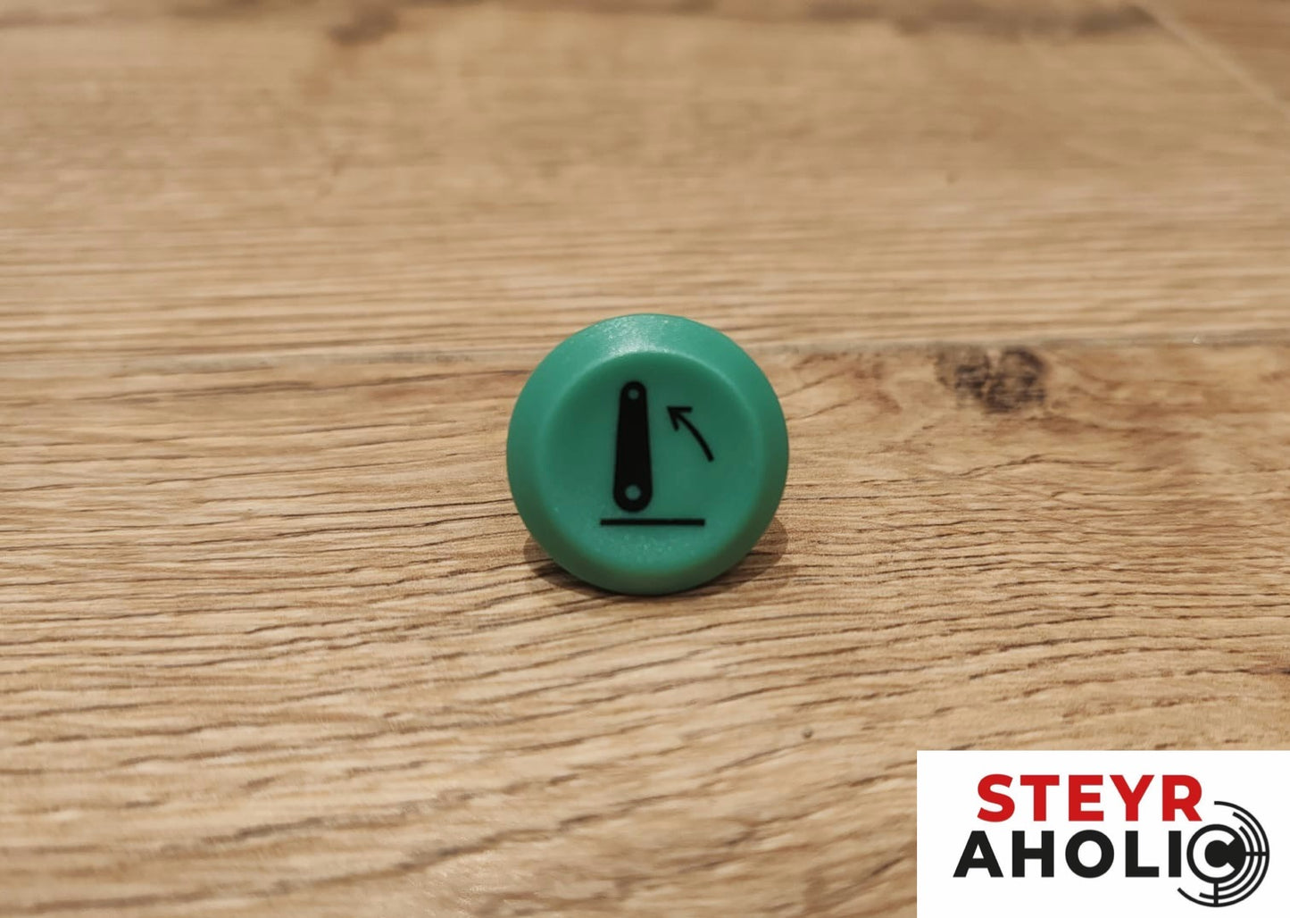 Emblem für die Druckschalter Heben grün